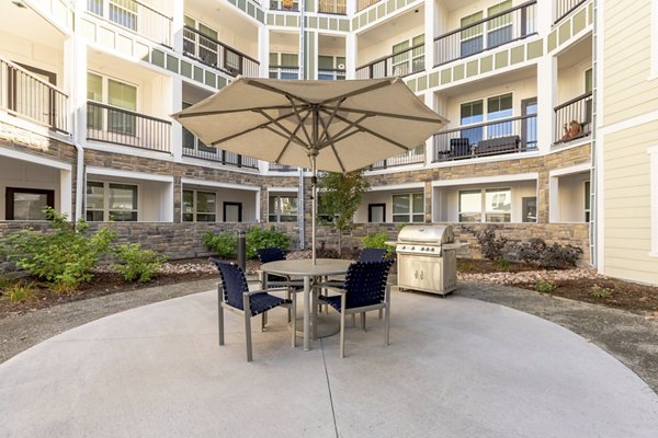 Grill area with modern BBQ stations at Five810 Southlands Apartments