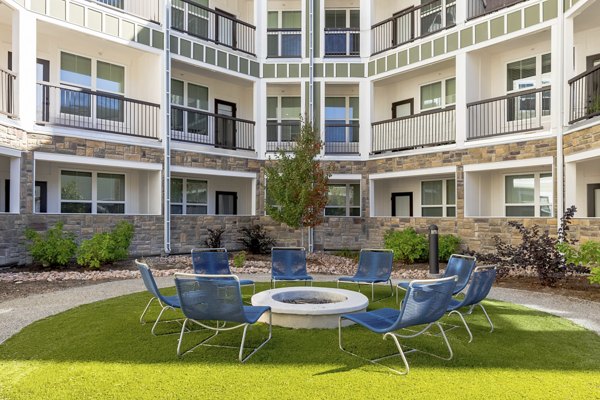 Cozy outdoor fire pit area at Five810 Southlands Apartments, perfect for relaxing evenings under the stars