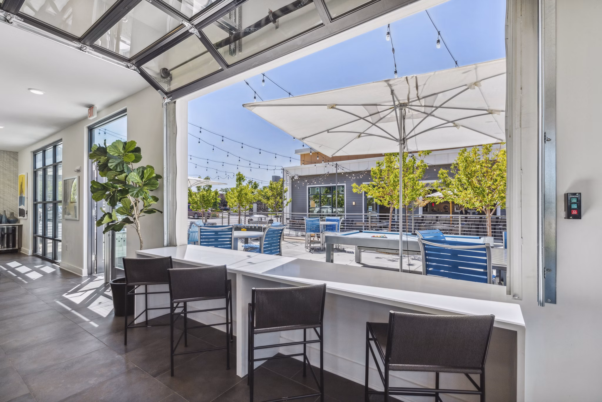Stylish clubhouse with modern seating at Mezz at Fiddler's Green Apartments