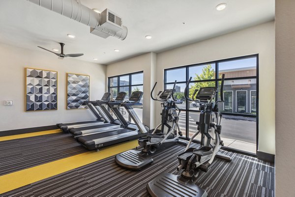 Modern fitness center with state-of-the-art equipment at Mezz at Fiddler's Green Apartments