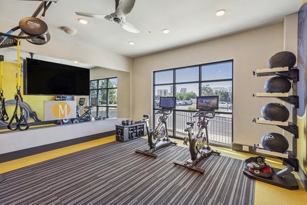 fitness center at Mezz at Fiddler's Green Apartments