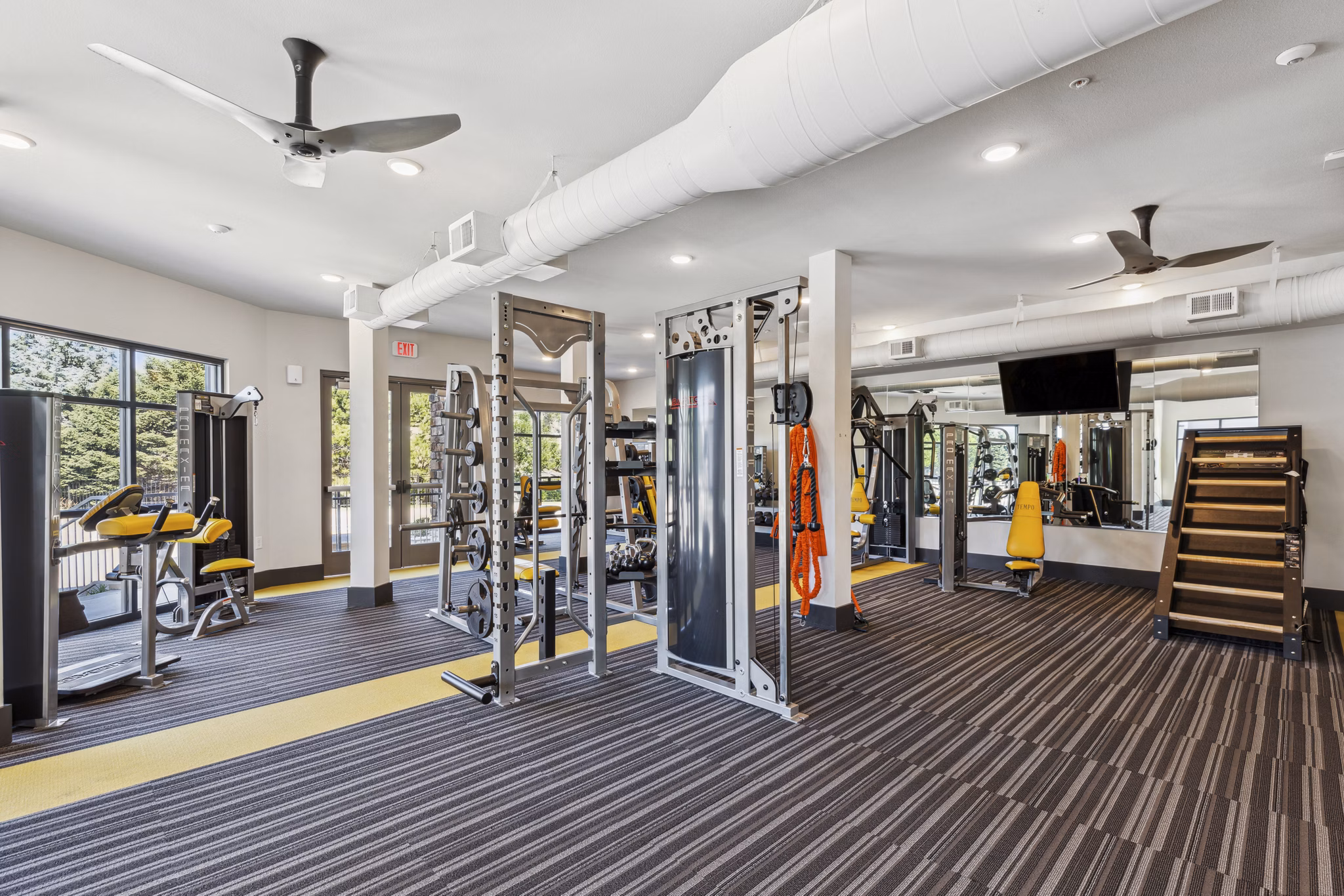 State-of-the-art spin studio with modern equipment at Mezz at Fiddler's Green Apartments