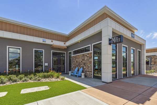 Fire pit on a cozy patio at Mezz at Fiddler's Green Apartments, offering relaxation and outdoor enjoyment in modern luxury settings