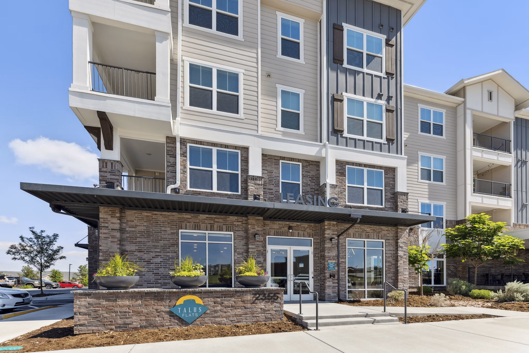 Talus Flats: Scenic outdoor view at luxury apartments in Castle Rock, CO, featuring modern architecture.