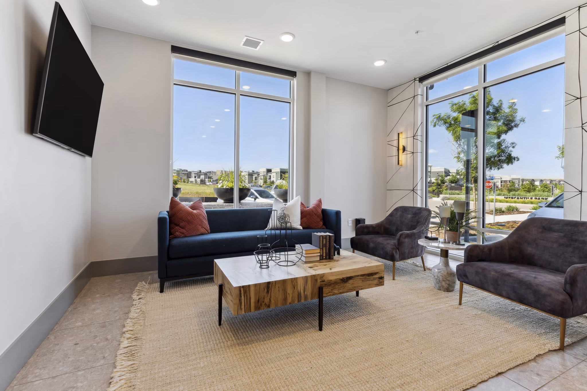 Modern clubhouse with lounge seating at Talus Flats Apartments, offering luxury amenities and social spaces for residents