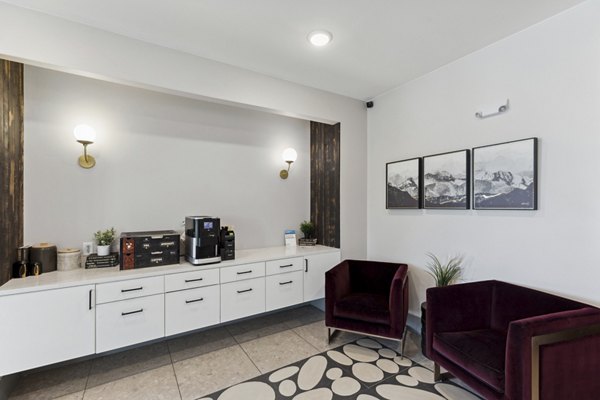 Talus Flats Apartments: Modern clubhouse featuring sleek design elements and cozy seating spaces for residents and guests