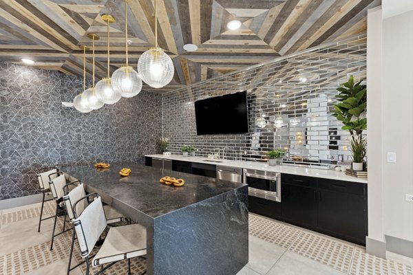 Clubhouse featuring modern design and entertainment spaces at Talus Flats Apartments luxury community