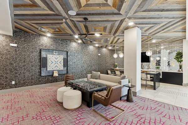 Clubhouse featuring modern design and comfortable seating at Talus Flats Apartments in Greystar luxury community