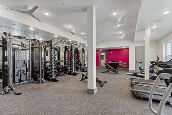 Talus Flats Apartments: Modern fitness center with state-of-the-art equipment and spacious workout areas