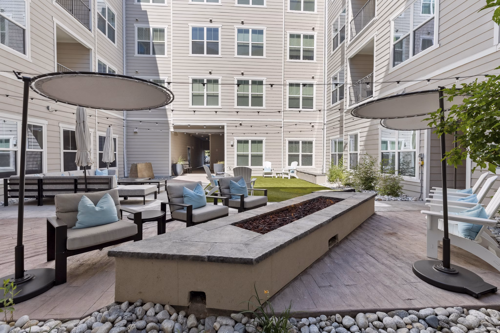 Cozy fire pit seating area at Talus Flats Apartments, perfect for outdoor gatherings and relaxation