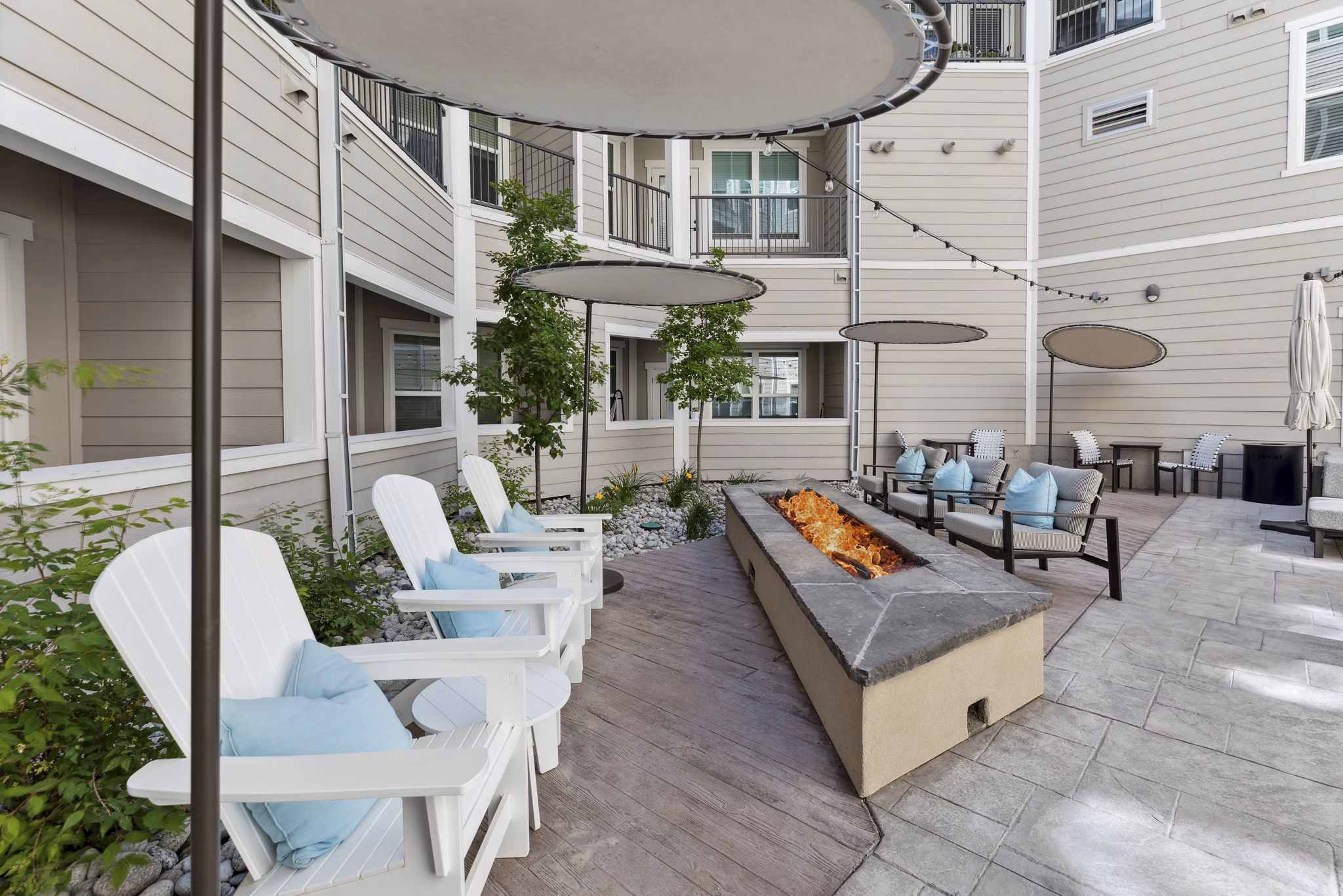 Cozy outdoor fire pit area with comfortable seating at Talus Flats Apartments