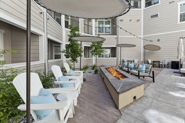 Cozy outdoor fire pit area with comfortable seating at Talus Flats Apartments