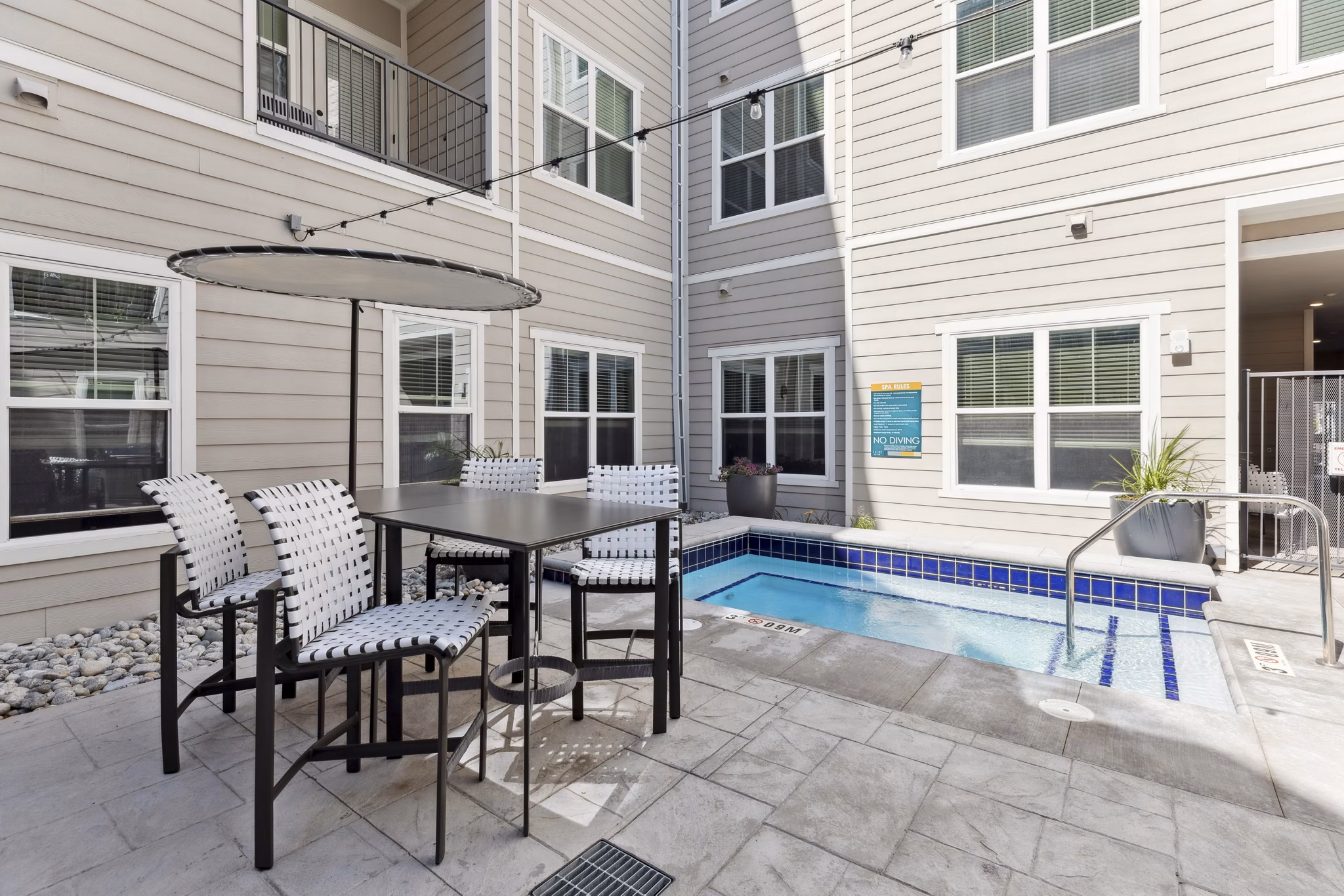 Cozy patio with modern seating at Talus Flats Apartments, perfect for outdoor relaxation and social gatherings