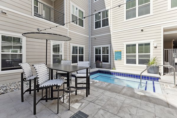 Cozy patio with modern seating at Talus Flats Apartments, perfect for outdoor relaxation and social gatherings