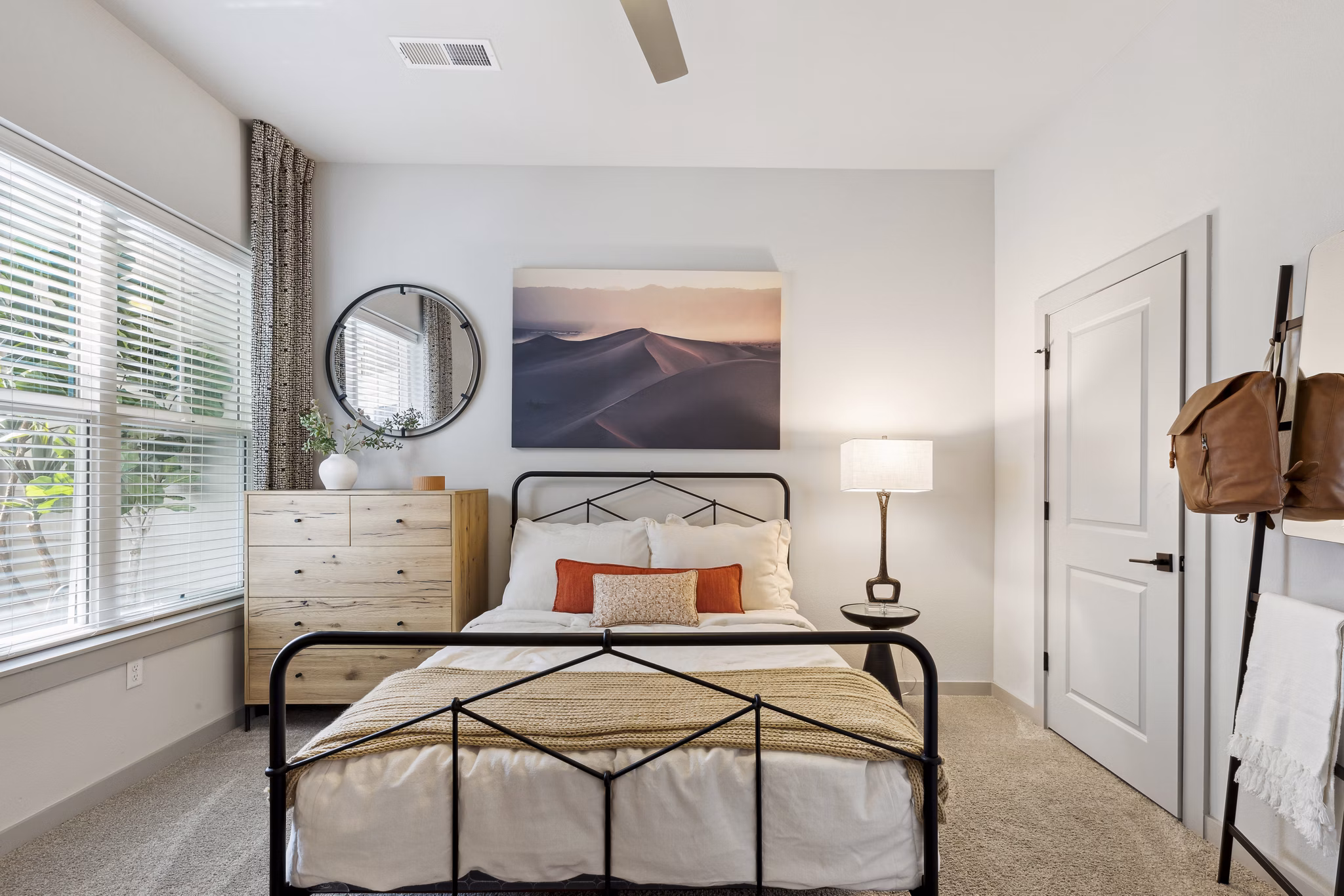 The Zeb Apartments: Modern bedroom with stylish decor and ample natural light