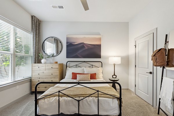 The Zeb Apartments: Modern bedroom with stylish decor and ample natural light
