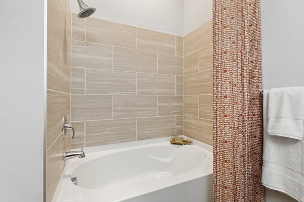 Modern bathroom with luxurious fixtures at The Zeb Apartments in a Greystar residence