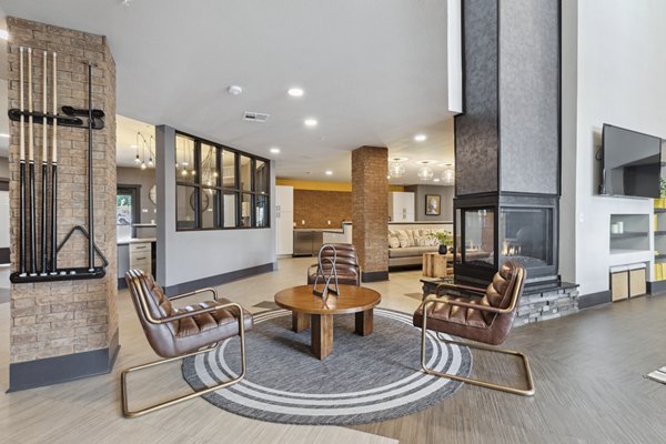 Clubhouse featuring modern lounge and entertainment area at The Zeb Apartments