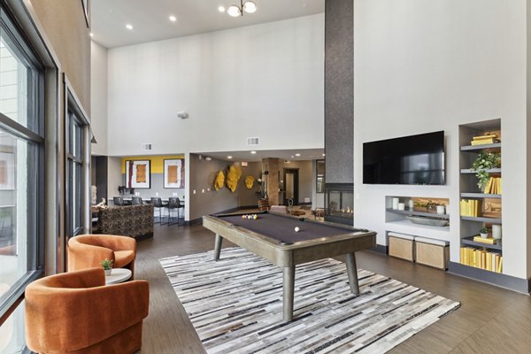 Modern clubhouse with contemporary seating and elegant lighting at The Zeb Apartments, a luxury Greystar property in a vibrant community