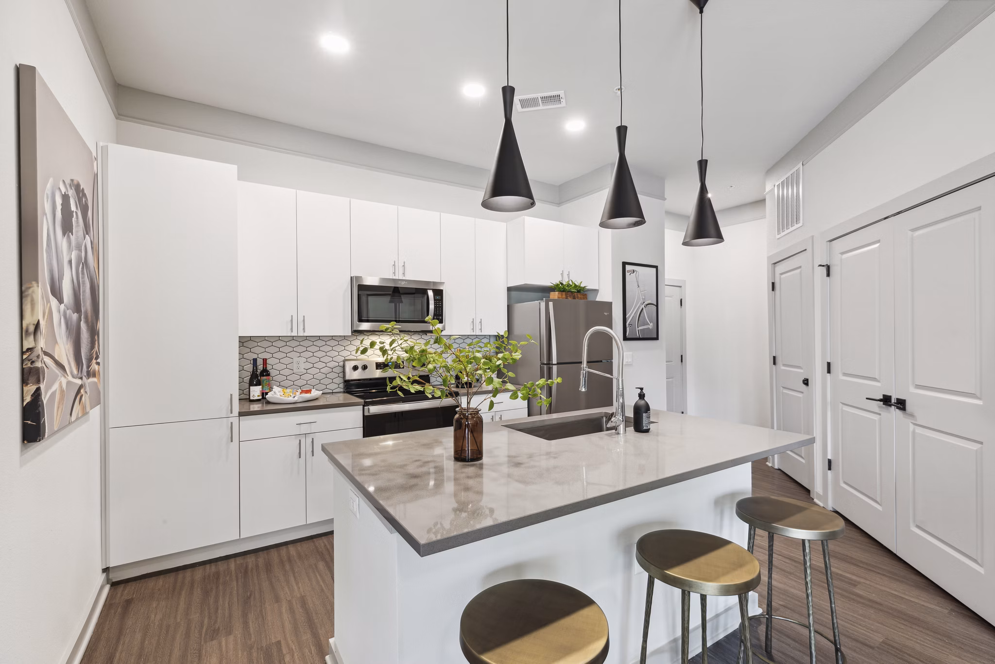 Modern kitchen with sleek countertops and stainless steel appliances at The Zeb Apartments