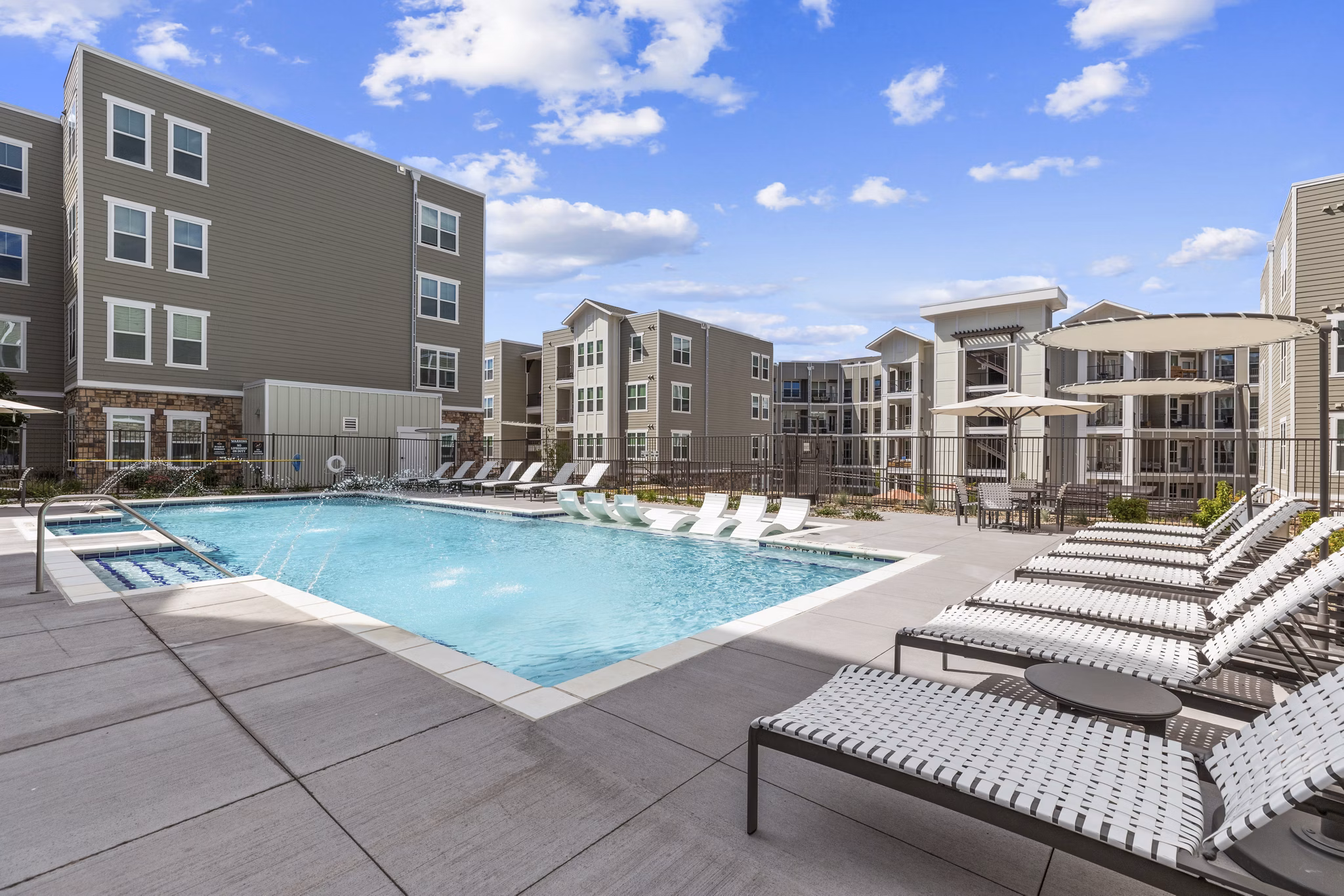 Rooftop pool with city views at The Zeb Apartments, a luxury Greystar community