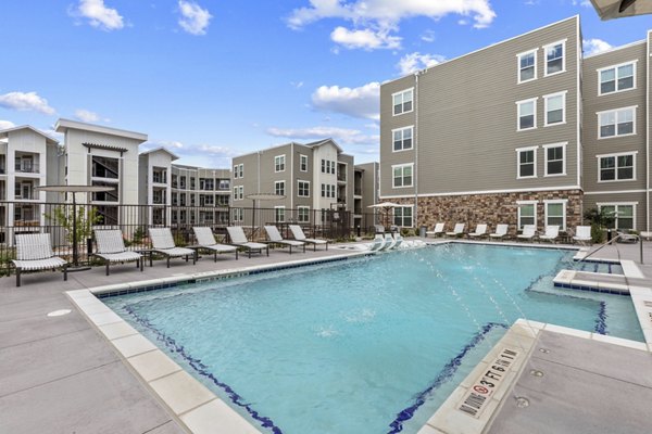 Rooftop pool with skyline views at The Zeb Apartments