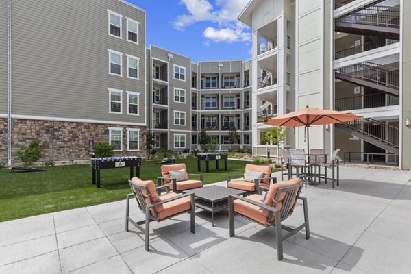 Courtyard featuring modern seating and lush landscaping at The Zeb Apartments, offering luxury living in a Greystar community