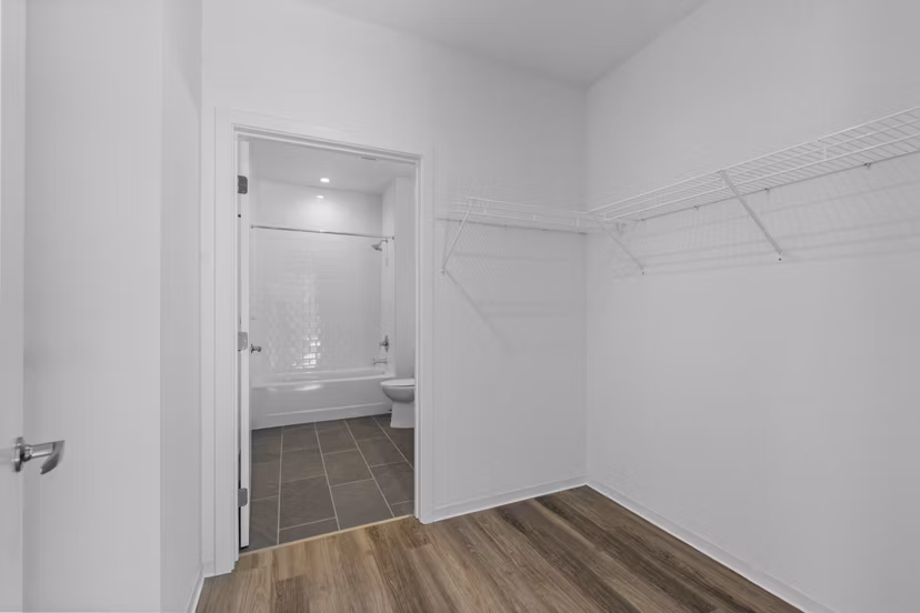 Closet with custom shelving and ample storage space in The Clark Apartments