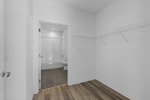 Closet with custom shelving and ample storage space in The Clark Apartments