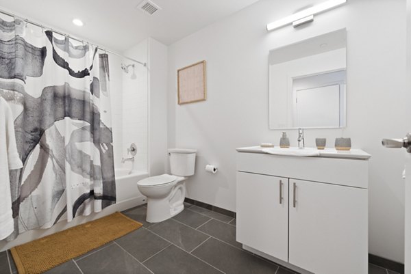 Spacious bathroom featuring modern fixtures at The Clark Apartments, a luxury community by Greystar