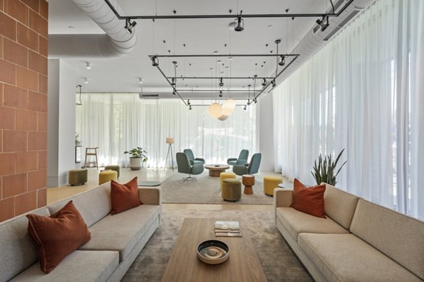 Elegant clubhouse with modern furnishings at The Clark Apartments