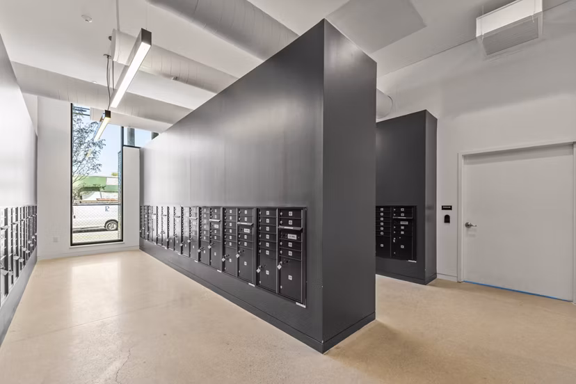 Modern mail room with secure parcel lockers at The Clark Apartments, a Greystar luxury property