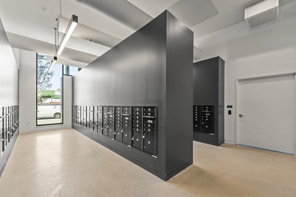 Modern mail room with secure parcel lockers at The Clark Apartments, a Greystar luxury property