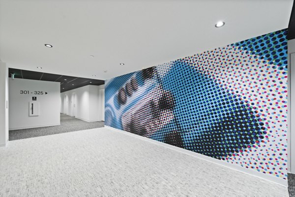 Elegant clubhouse with modern decor at The Clark Apartments, offering residents a luxurious space for relaxation and socializing