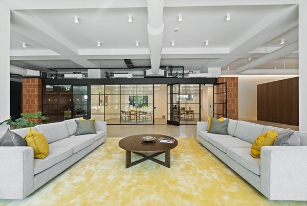 Modern clubhouse with sleek furnishings at The Clark Apartments, offering luxury living spaces in the heart of the city