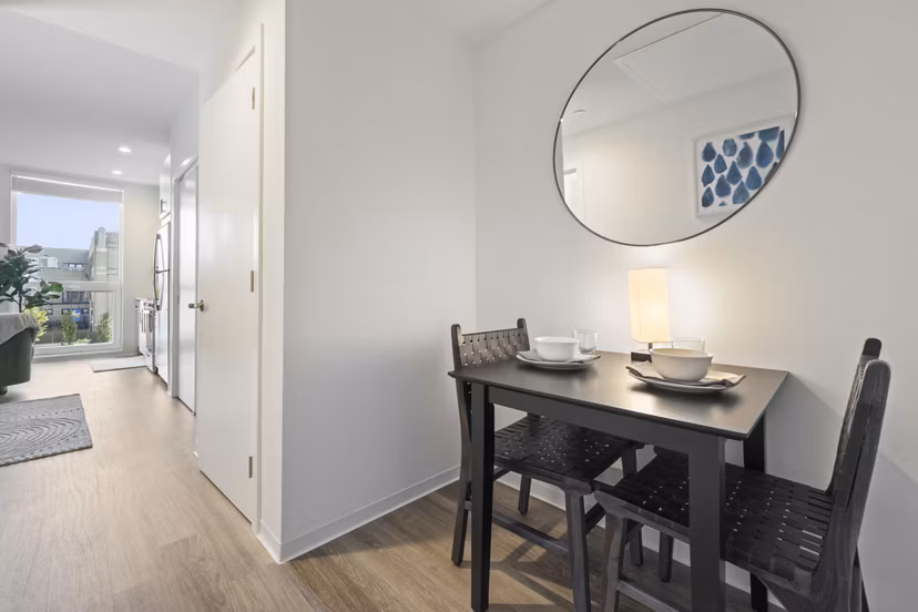 Elegant dining area with modern furnishings at The Clark Apartments