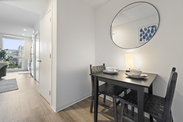Elegant dining area with modern furnishings at The Clark Apartments