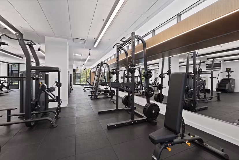 State-of-the-art fitness center with modern equipment at The Clark Apartments
