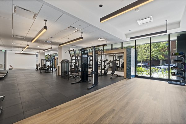 State-of-the-art fitness center featuring modern equipment at The Clark Apartments