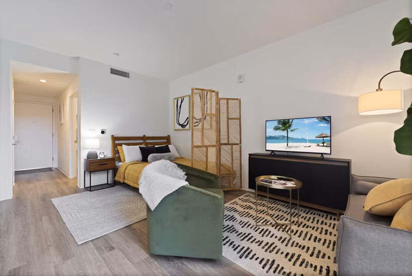 Spacious kitchen with marble countertops and stainless steel appliances in The Clark Apartments