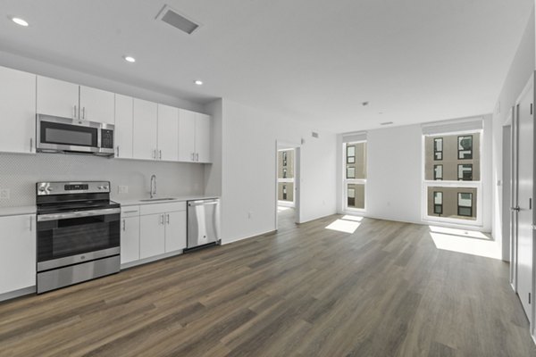 Stylish kitchen with stainless steel appliances in The Clark Apartments