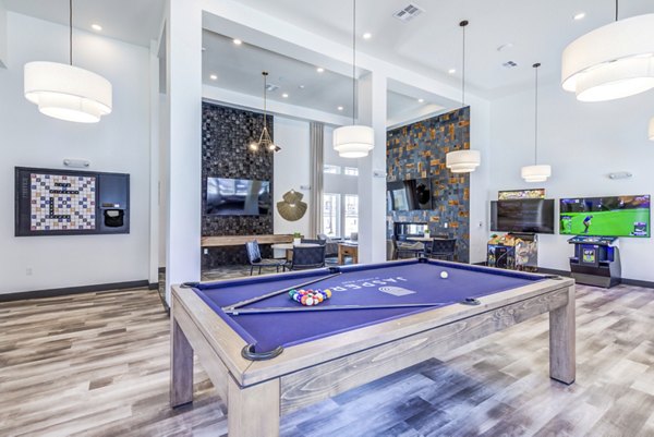 clubhouse game room area at Jasper at Victory Ridge Apartments