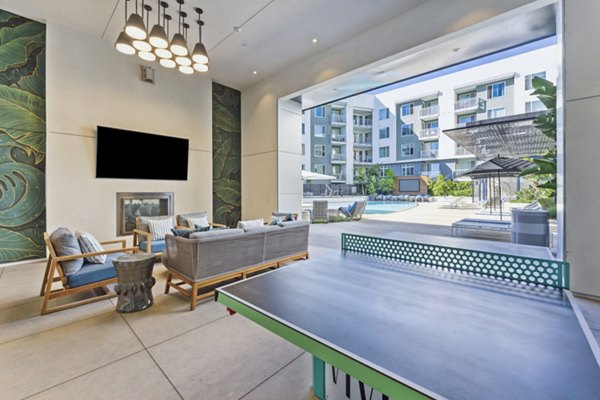 clubhouse game room/patio at Vive Luxe Apartments
