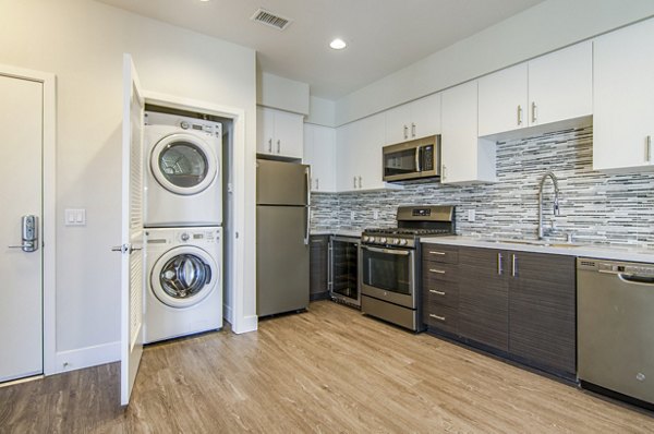 kitchen/laundry at Vive on the Park Apartments