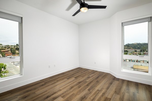 Contemporary bedroom with elegant decor at Vora Lux Apartments