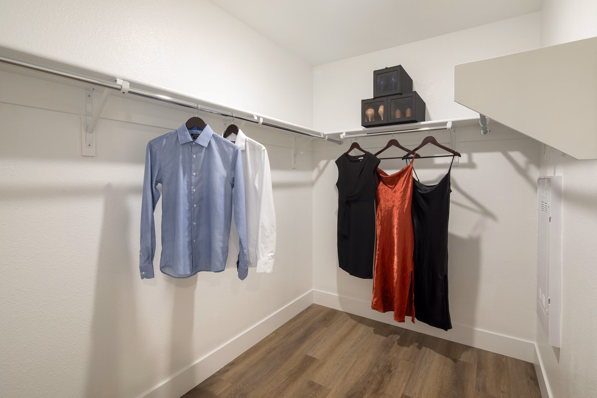 Spacious closet with modern shelving at Vora Lux Apartments
