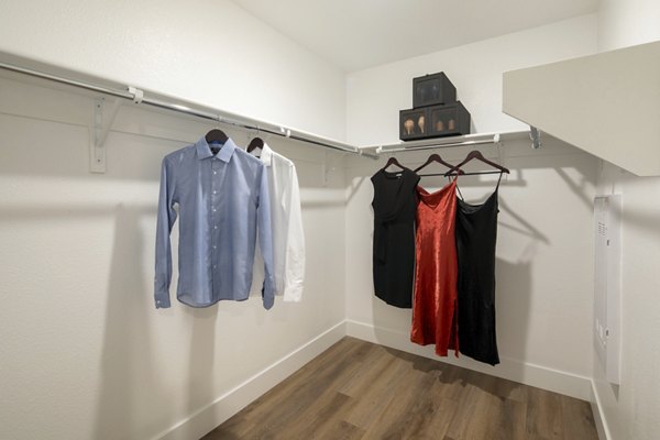 Spacious closet with modern shelving at Vora Lux Apartments