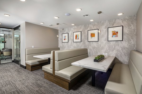 Clubhouse with modern design and seating areas at Vora Lux Apartments, a luxury Greystar property