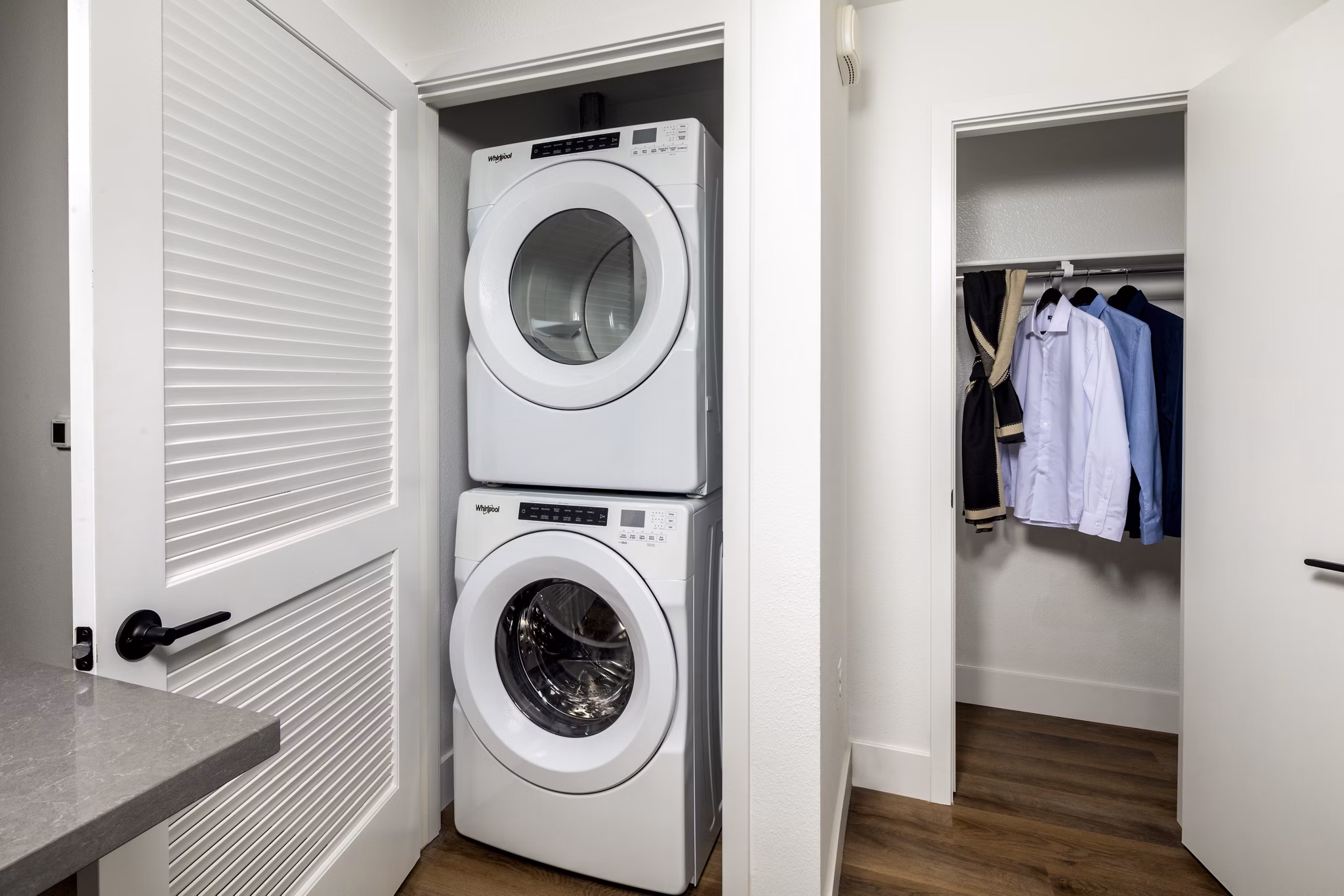 Efficient laundry room with modern washers and dryers at Vora Lux Apartments