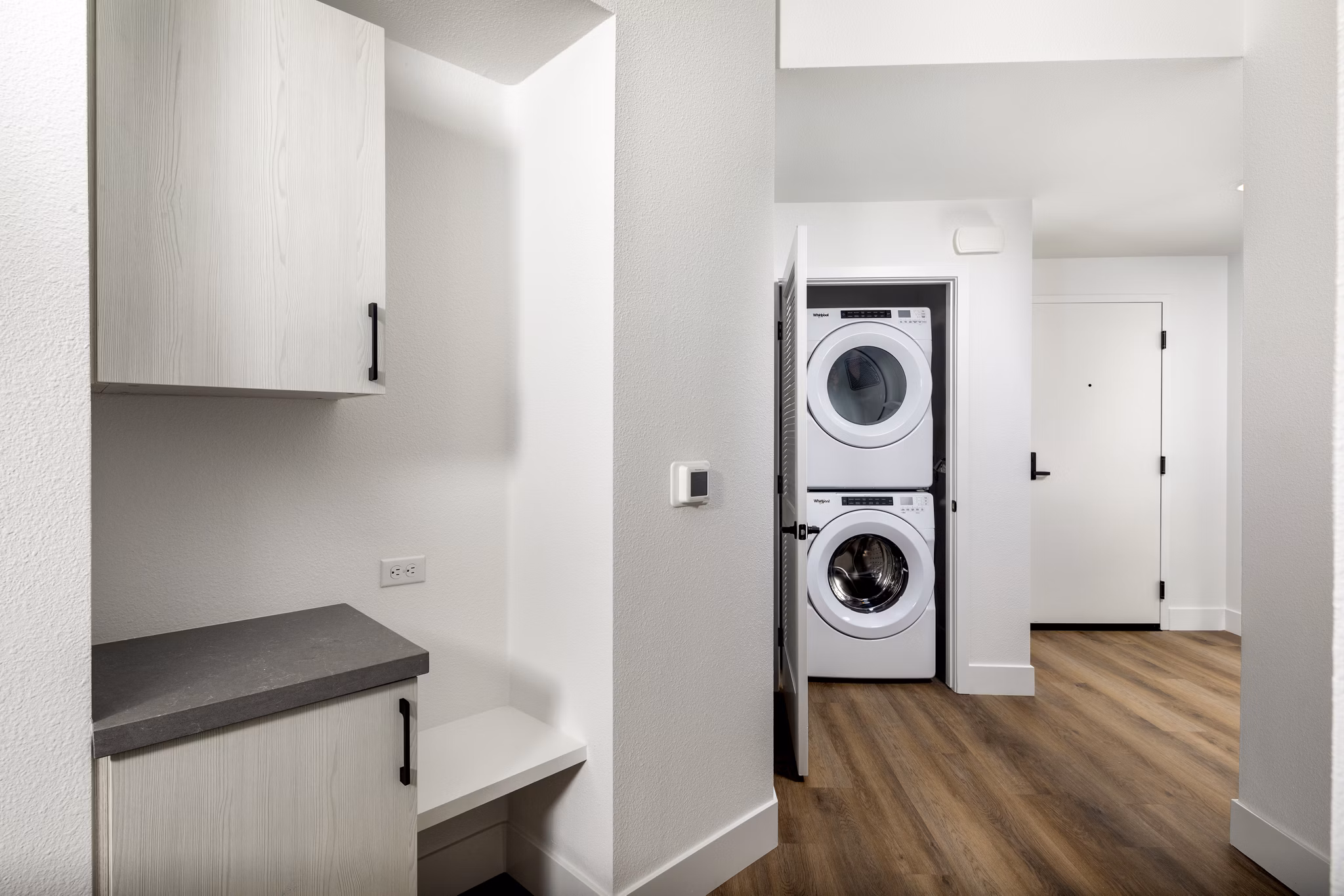 Laundry room with modern appliances at Vora Lux Apartments: Convenient and efficient facilities enhance luxury living experience